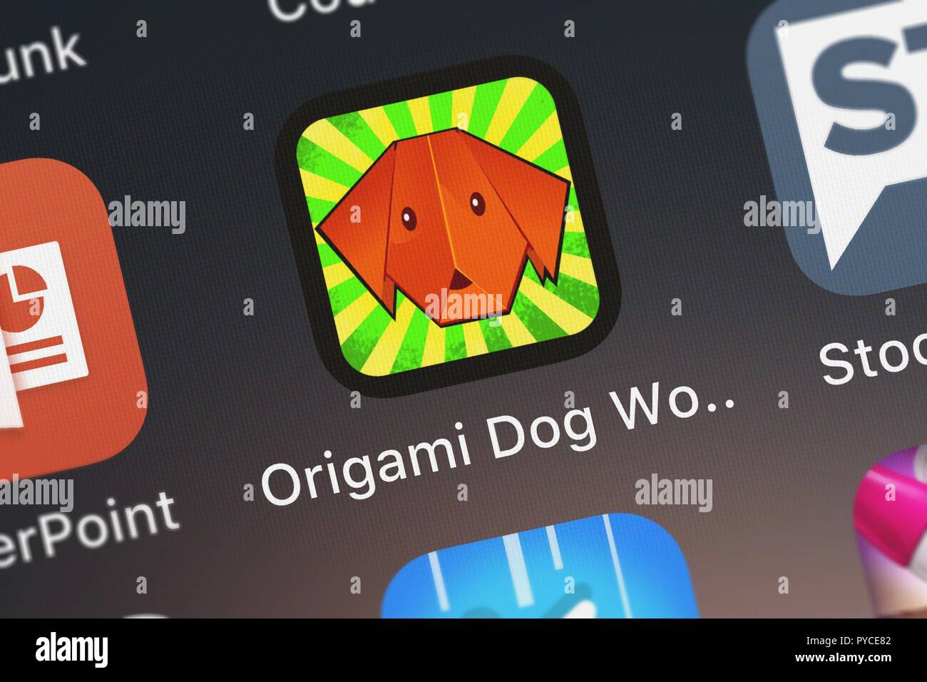 London, United Kingdom - October 26, 2018: Icon of the mobile app Origami Dog World from Psycho Bear Studios on an iPhone. Stock Photo