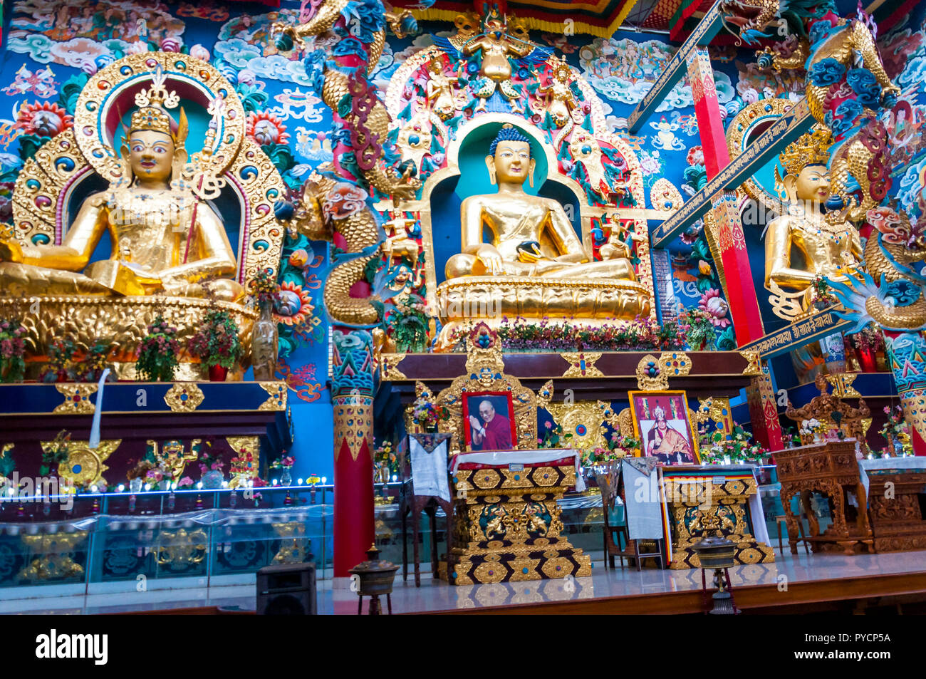 Bylakuppe, Karnataka, India - January 9, 2015: 18 meters high statues inside the Golden Temple - Padmasmbhava, the Buddha and Amitayus. Namdroling Nyi Stock Photo
