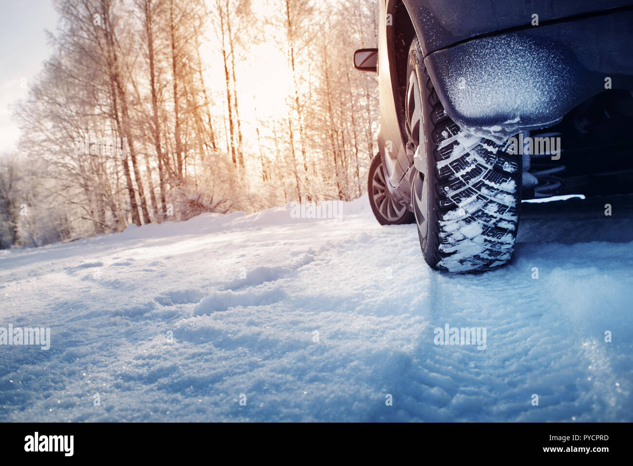 Car Tires On Winter Road Covered With Snow Stock Photo Alamy