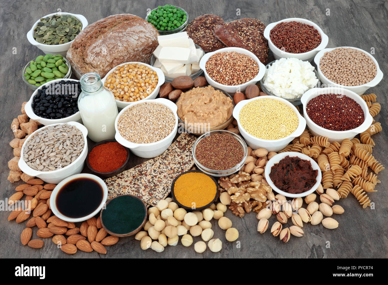 Large vegan health food with tofu bean curd, legumes, nuts, seeds