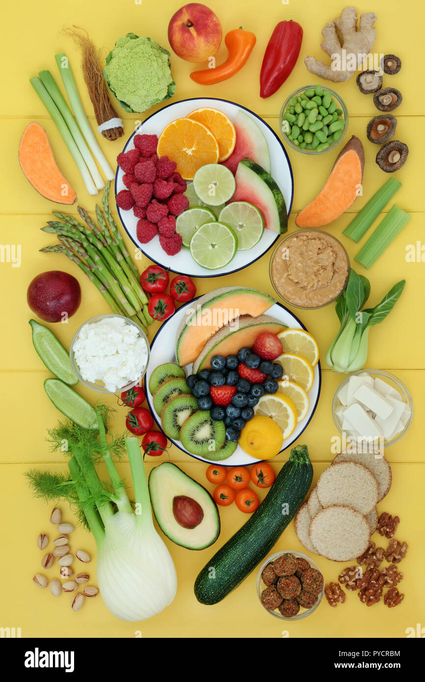 Healthy food for vegans with fruit, vegetables, peanut butter, almond