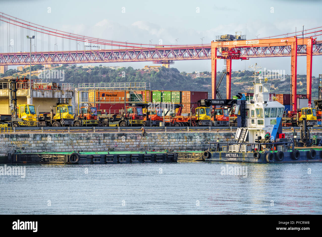 Port of Lisbon on the banks of the Tagus River with a backdrop of ...