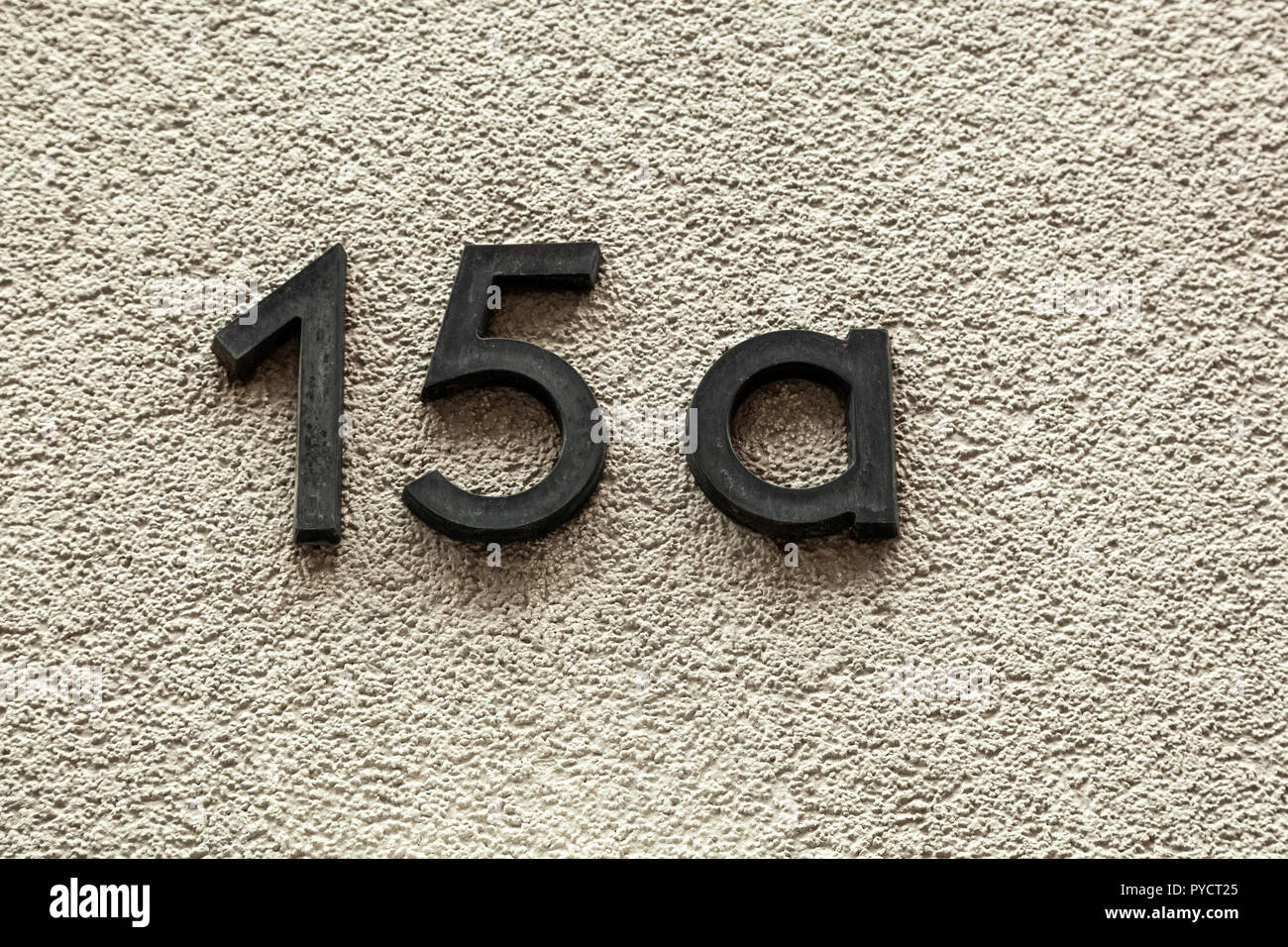 House number fifteen A 15A in designer font in cast black painted metal, weathered or tarnished from Sweden Stock Photo