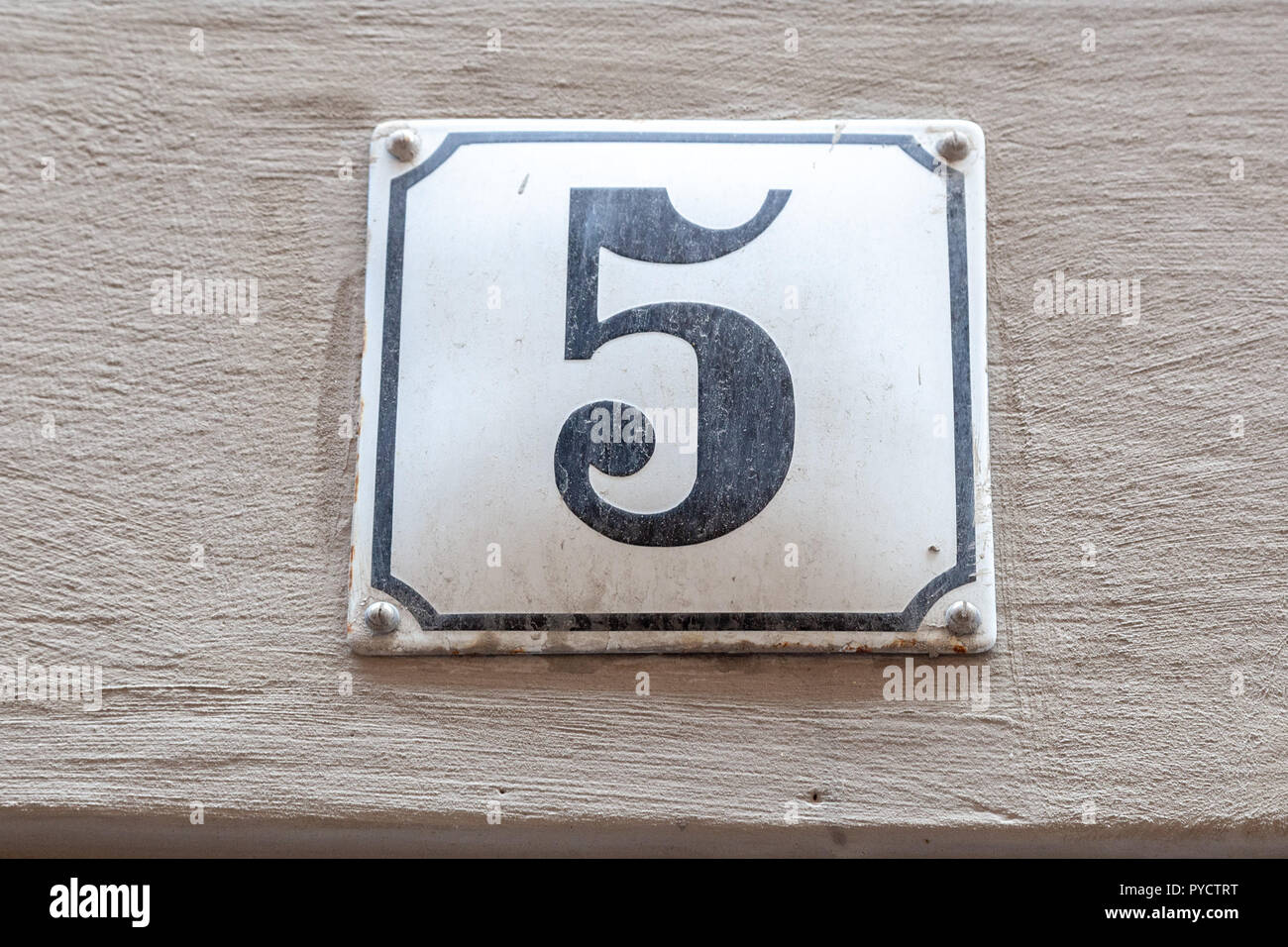 House number five 5 on enamel plaque in black and white from Sweden Stock Photo