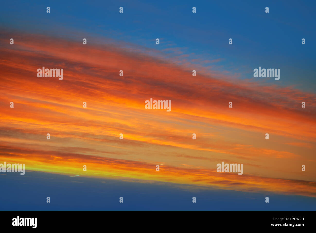 Sunset clouds sky in orange and blue background Stock Photo - Alamy