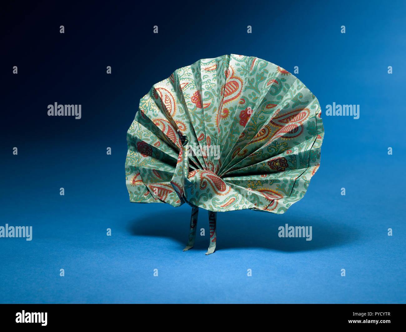 A Still Life Of A Paper Peacock Made With The Art Of Origami