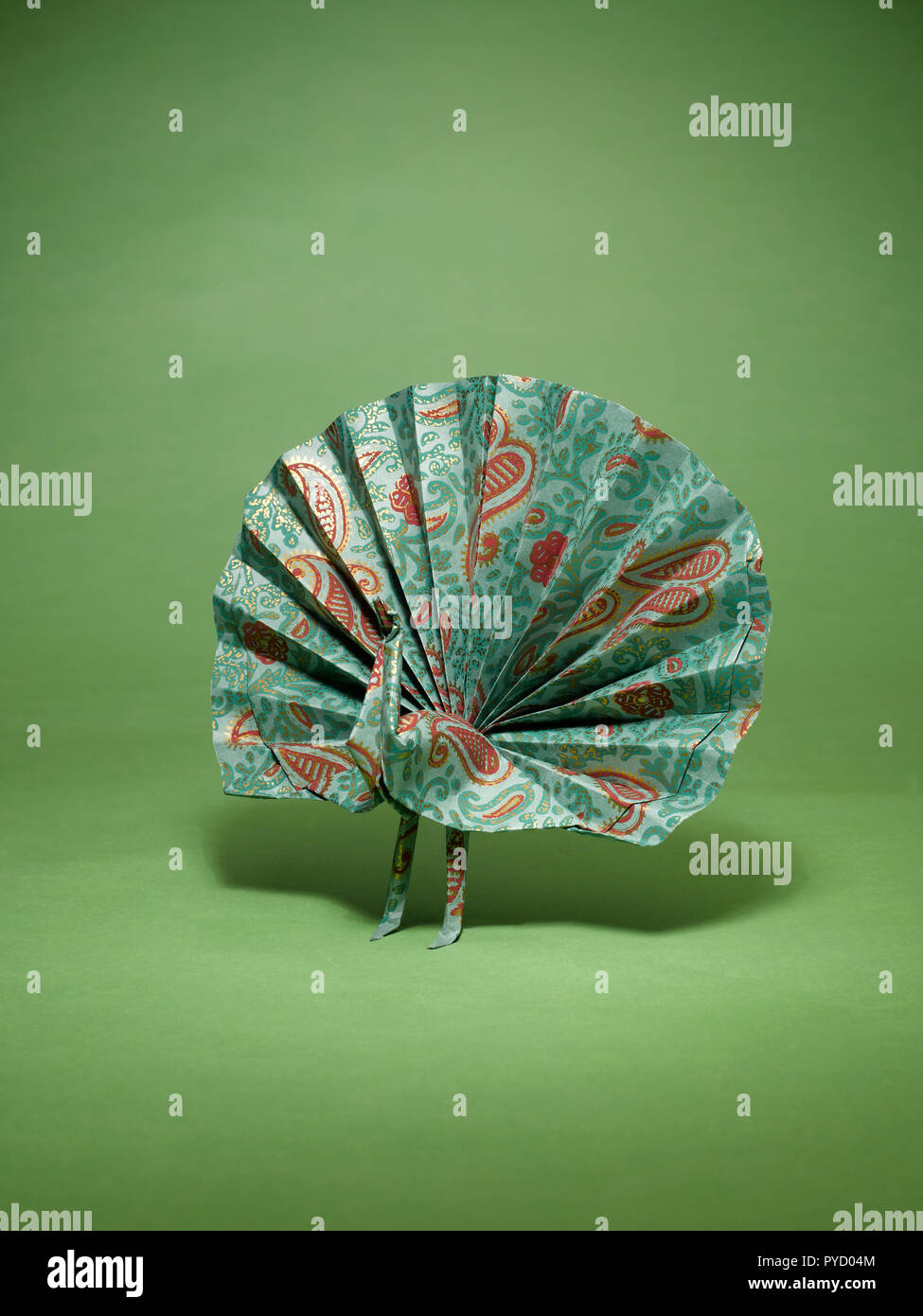 A Still Life Of A Paper Peacock Made With The Art Of Origami
