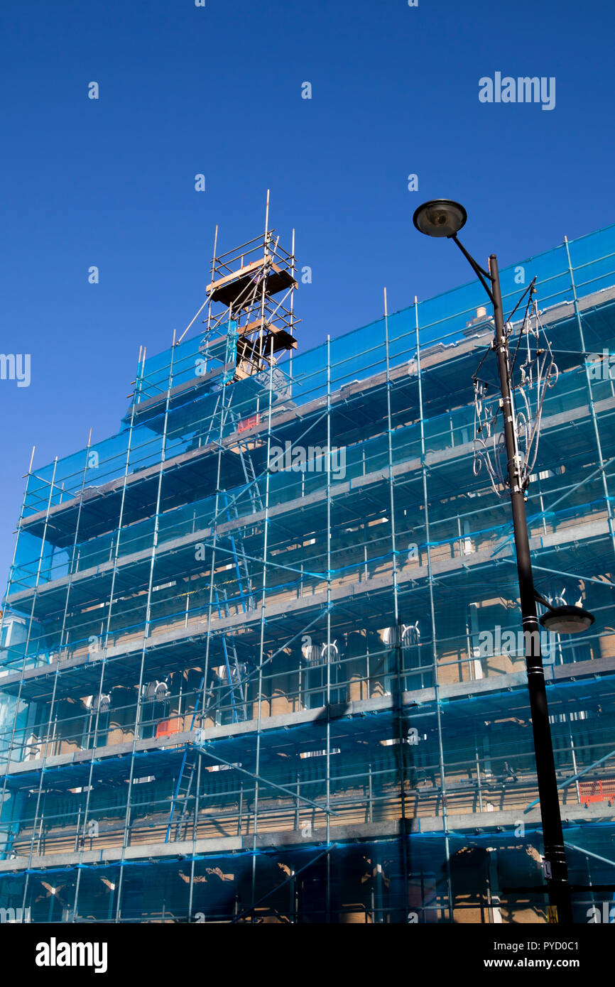scaffolding with safety netting, renovation works being carried to