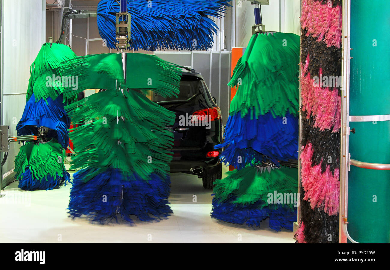 Car wash service with mop style brushes Stock Photo Alamy