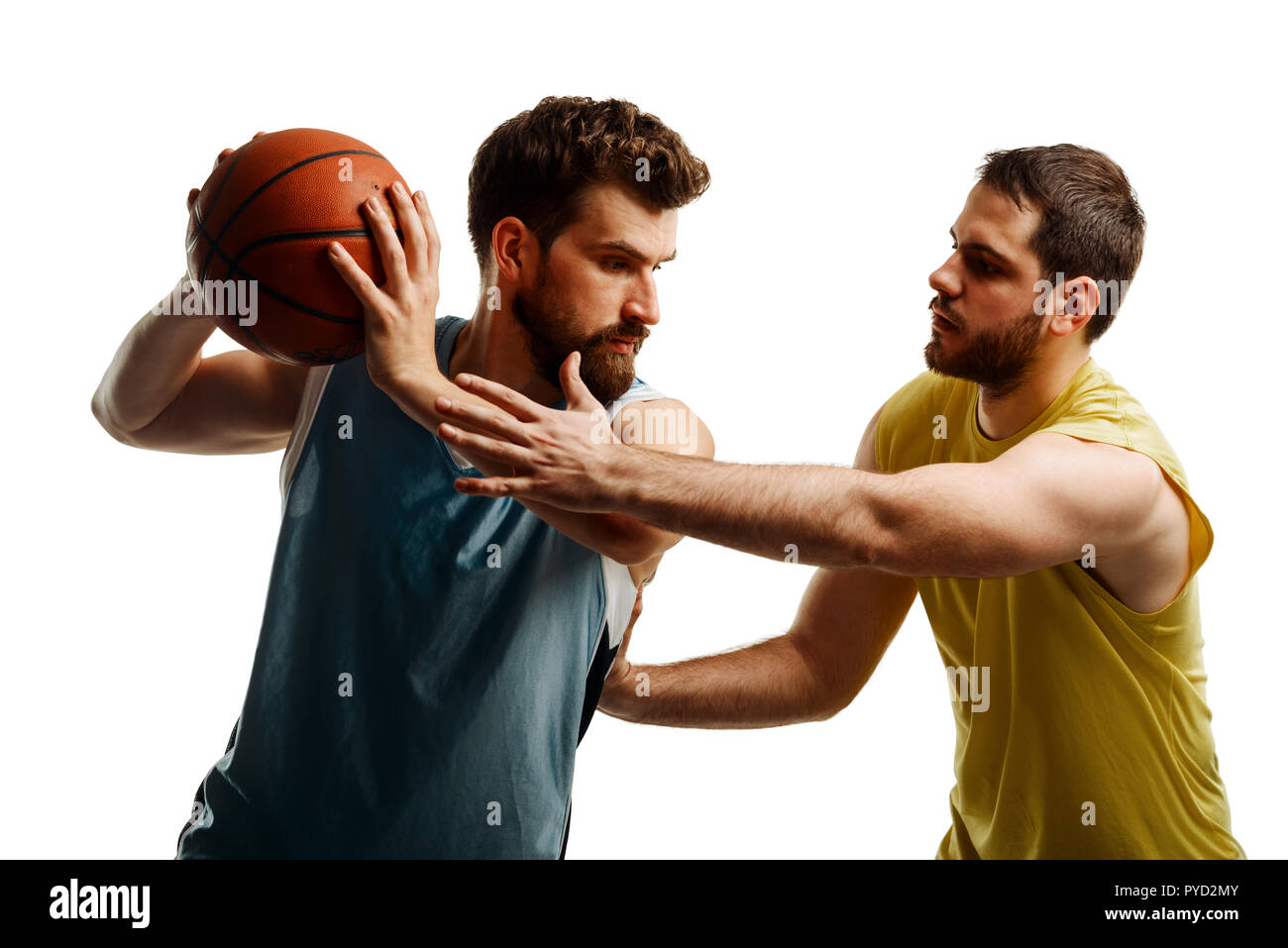 Basketball players fighting for ball Stock Photo