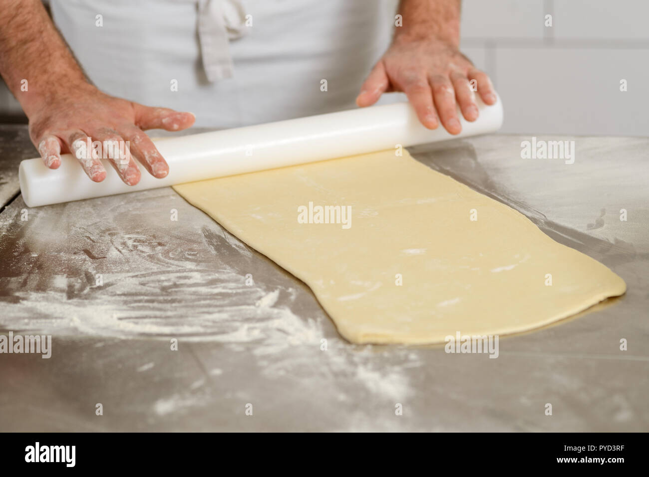 Preparing and rolling dough Stock Photo