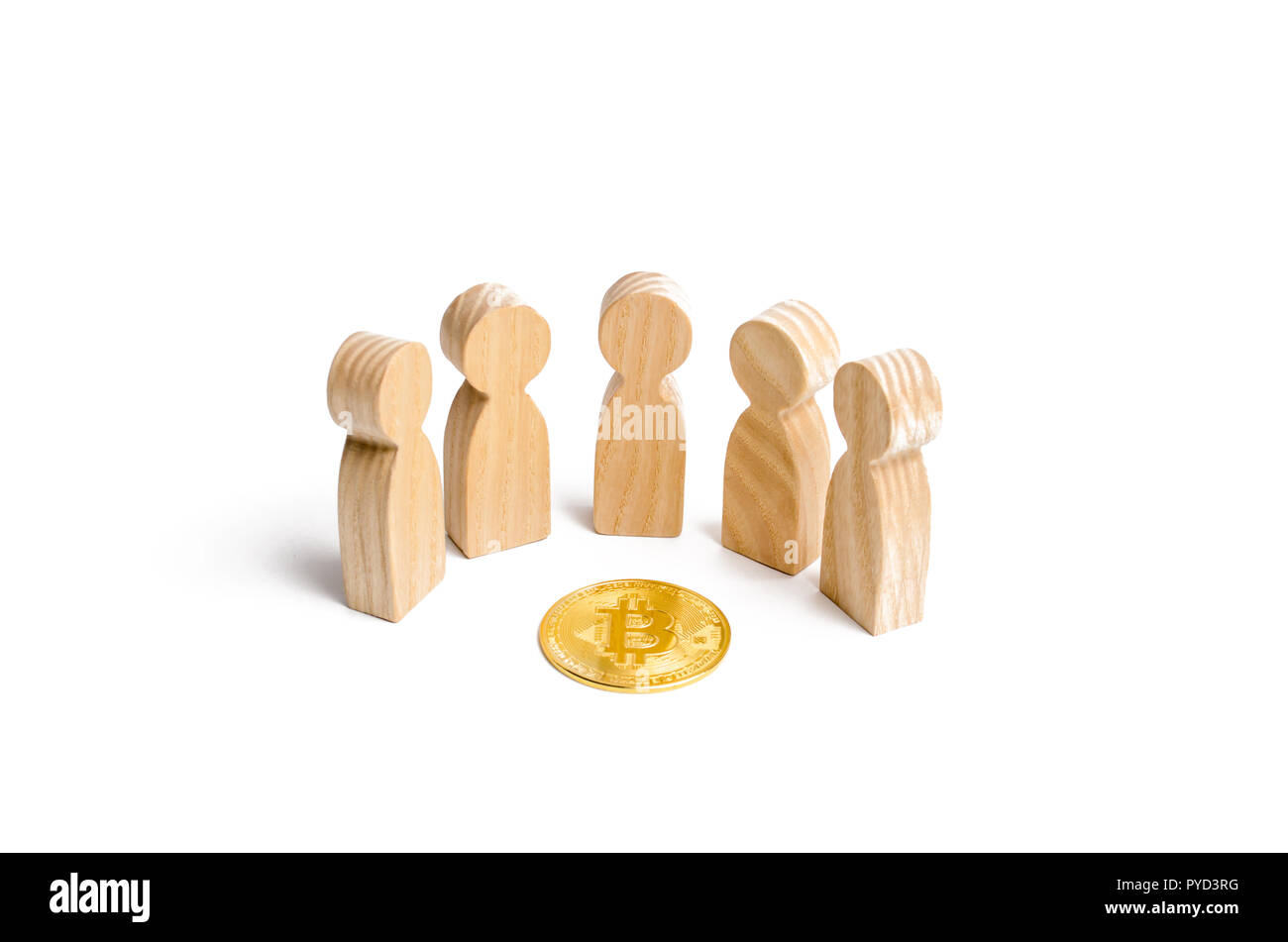 Wooden figurines of people are standing around a bitcoin coin on a ...