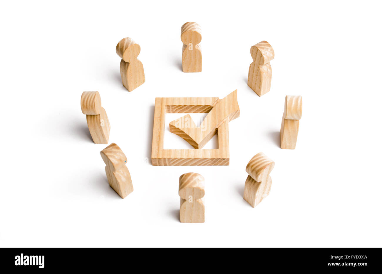 People stand in a circle and look at the check mark in the box