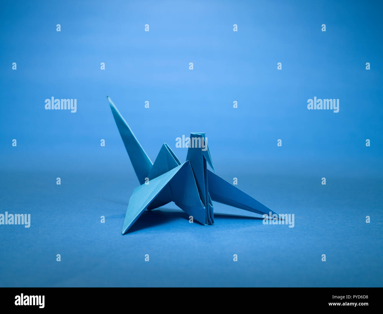 A STILL LIFE OF A PAPER CRANE MADE WITH THE ART OF ORIGAMI Stock Photo