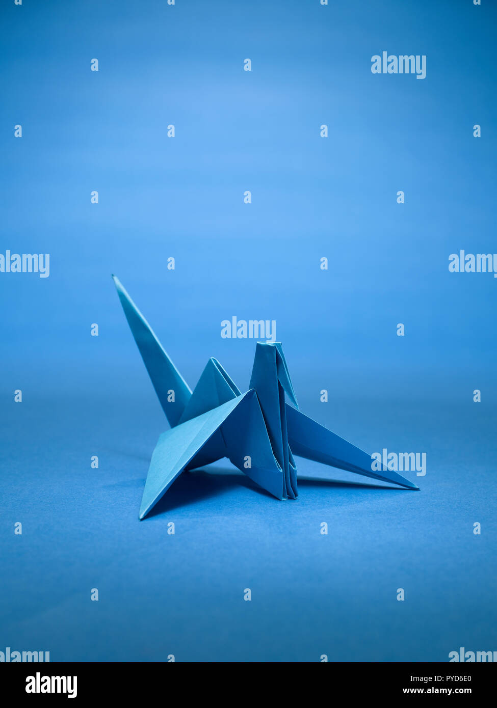 A STILL LIFE OF A PAPER CRANE MADE WITH THE ART OF ORIGAMI Stock Photo