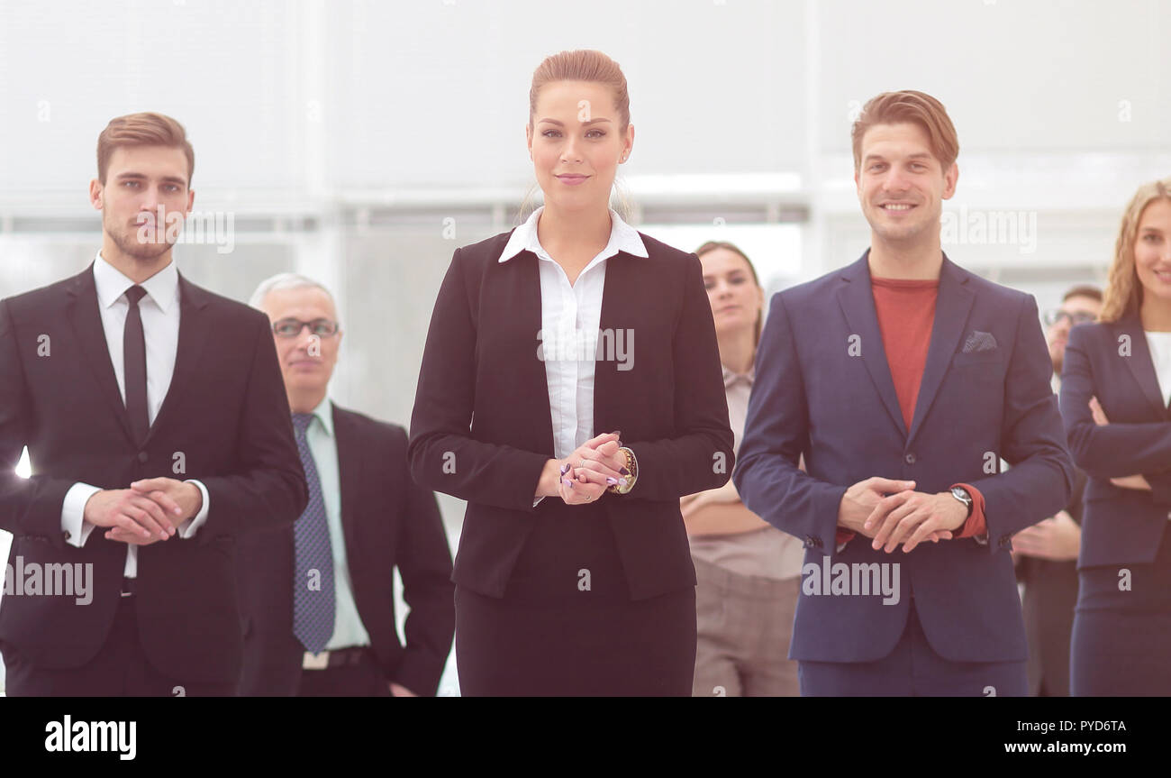 confident business woman standing in front of his business team Stock ...