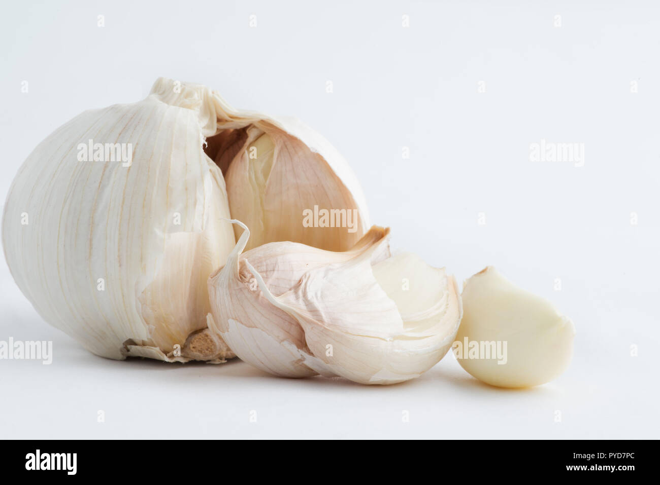 Fresh organic garlic cloves on white background Stock Photo - Alamy
