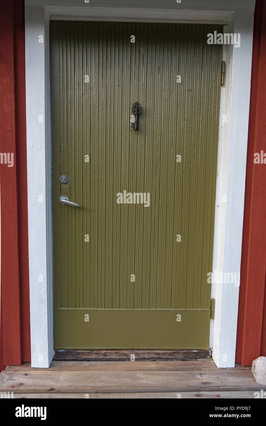 Green Door On A Little Red Cabin In Sweden Stock Photo 223413071