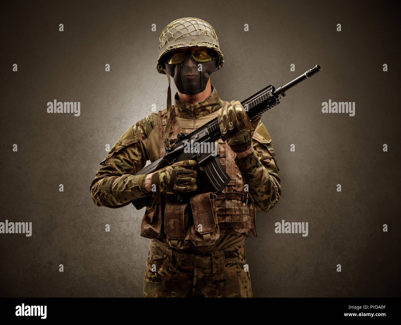 Soldier agent in a dark room with arms on his hand and gas mask Stock ...
