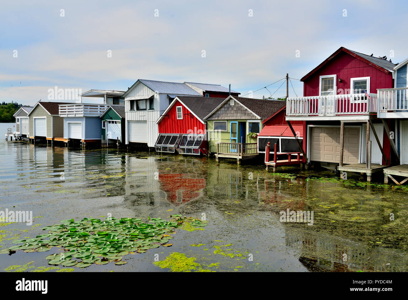 Wooden boat houses (Aquaholicks) along City Pier, Canandaigua Lake, one of the Finger Lakes, NY