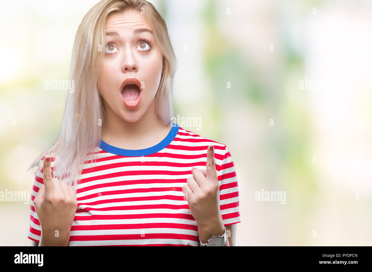 Young blonde woman over isolated background amazed and surprised ...