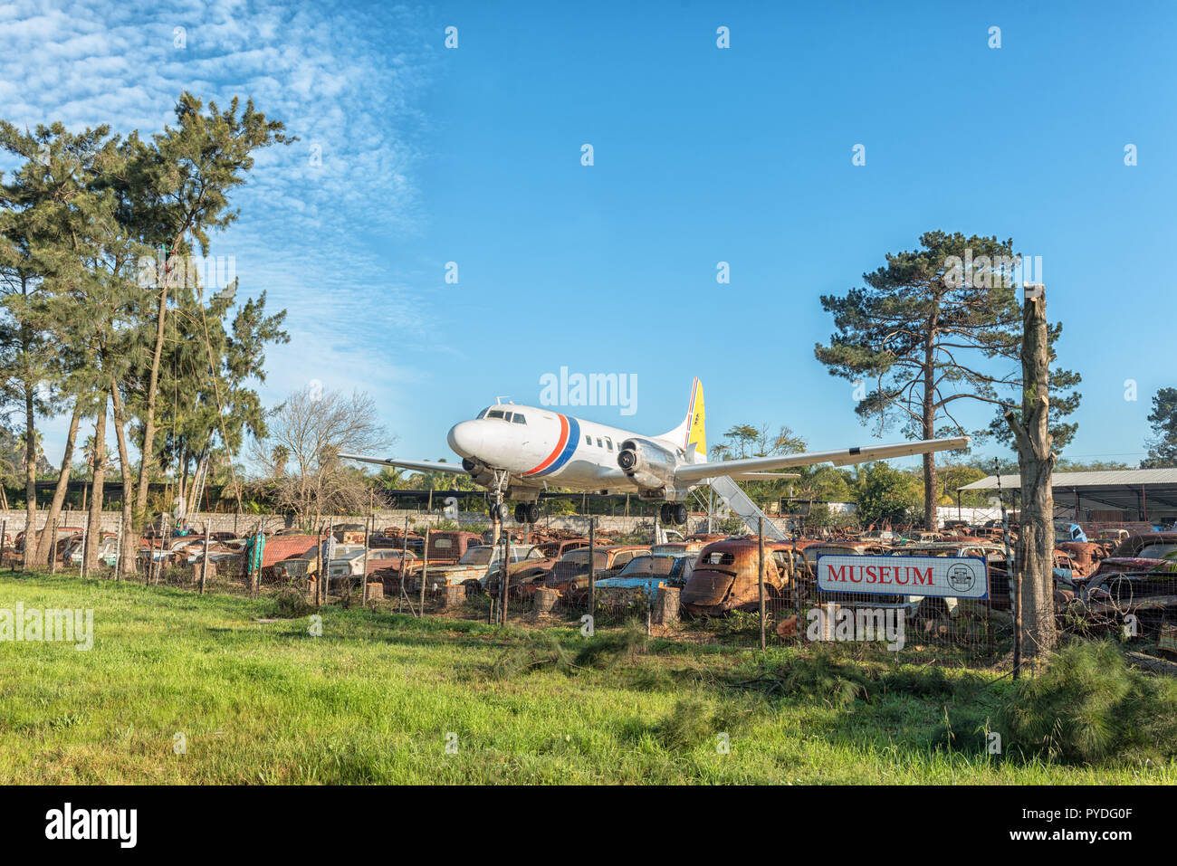 BELLVILLE, SOUTH AFRICA, AUGUST 15, 2018: A Convair Aeroplane and vintage cars waiting to be restored at the Wijnland Auto Museum near Bellville in th Stock Photo