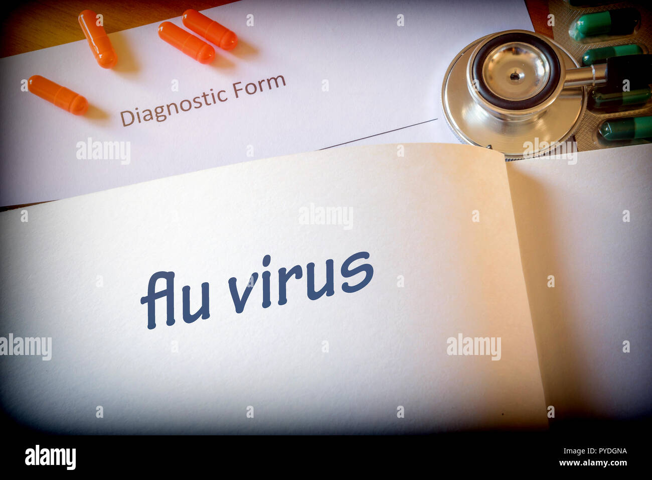 Diagnosis flu virus written in the diagnostic form and pills Stock Photo