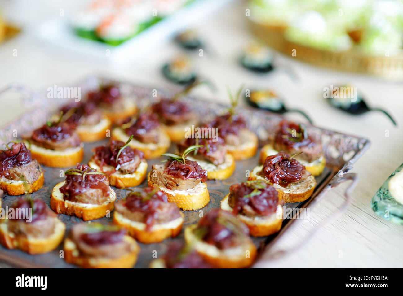 Delicious pate snacks with beet topping served on a party or wedding ...