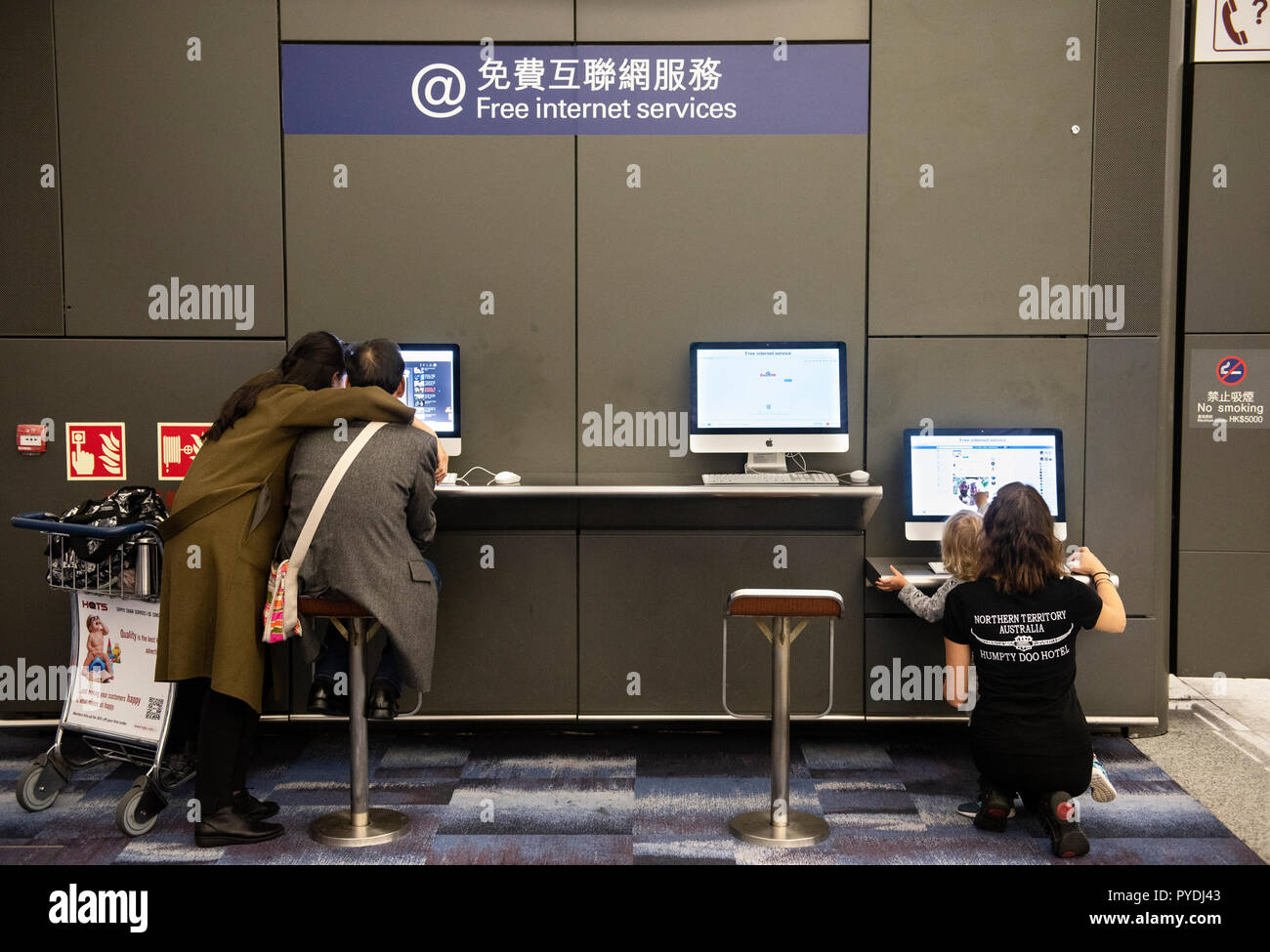 Passengers are seen using computers and free access at Hong