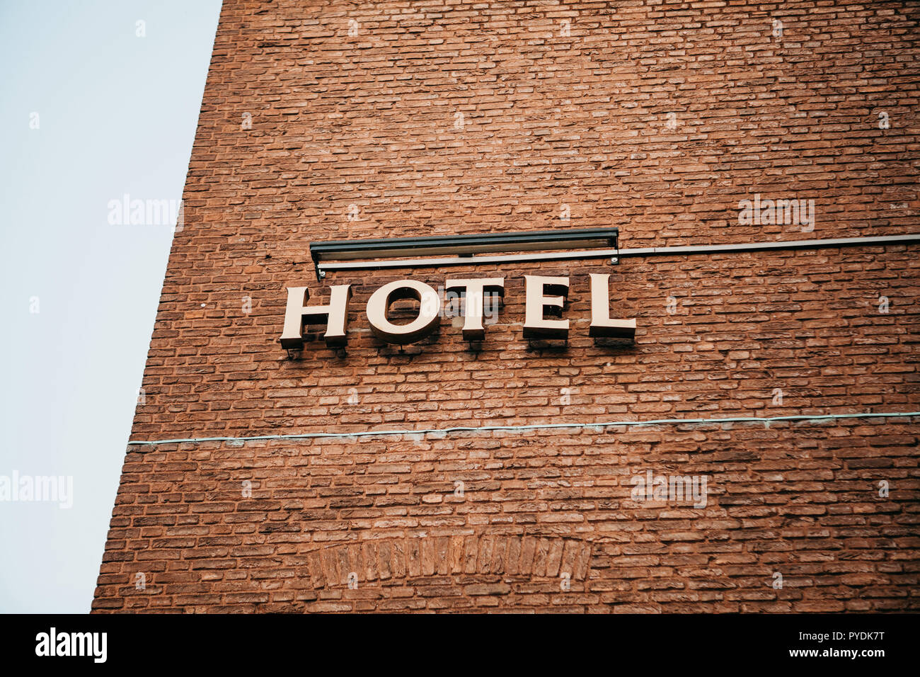Sign Hotel on the building. Place for booking rooms and recreation for ...