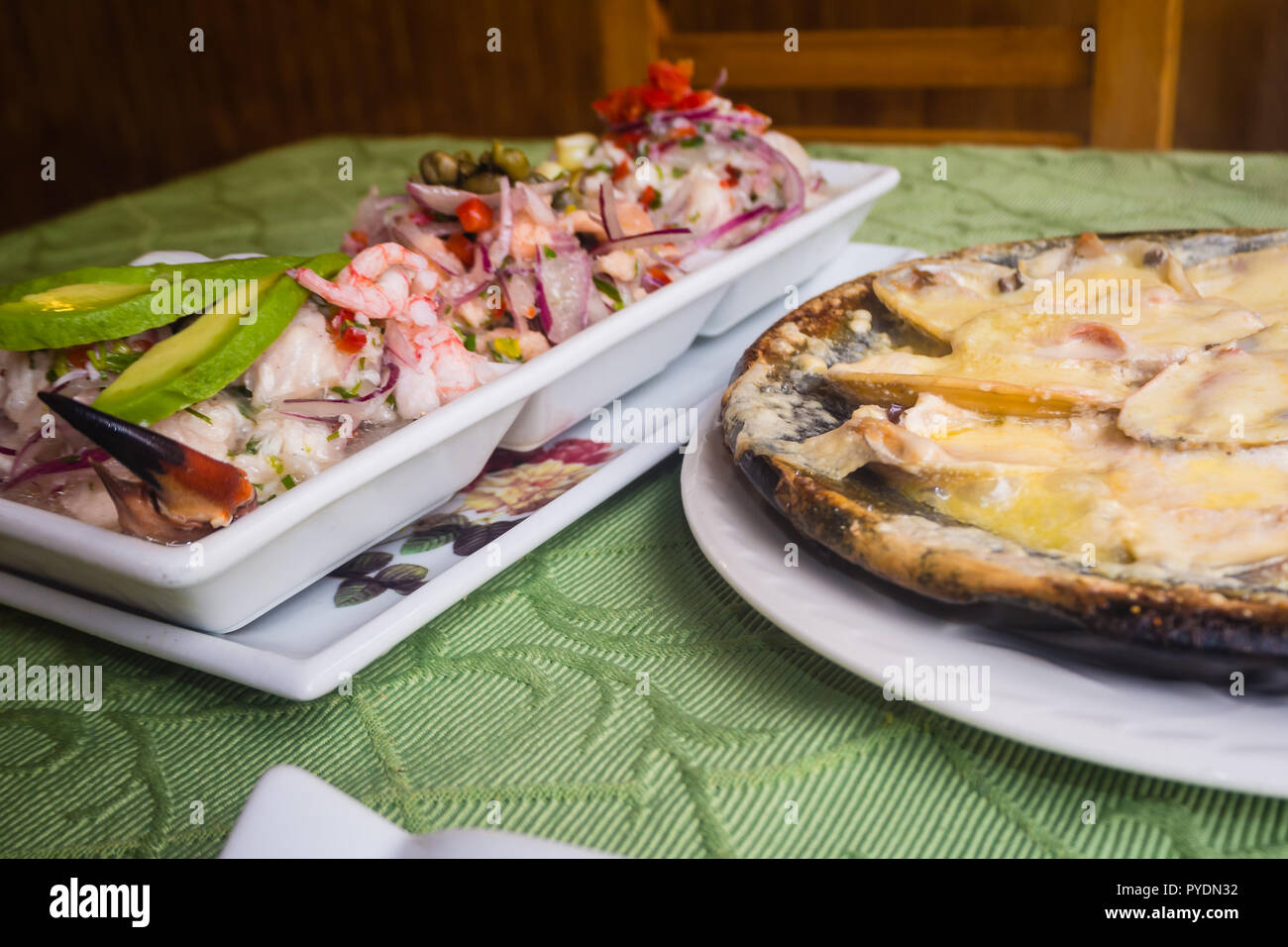 Tipical raw fish dish, ceviche. With vegetables, onion, red and green