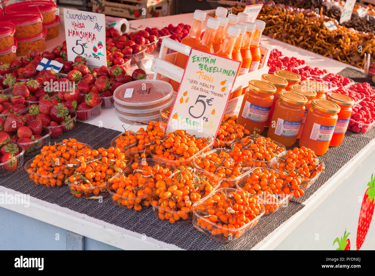 20 September 2018: Helsinki, Finland - Sea Buckthorn berries for sale at a farmer's market in the Market Square on the waterfront. Stock Photo