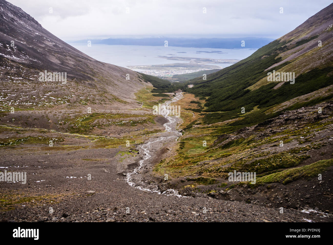 Valley of the Martial glacier and his river with Ushuaia and the Beagle channel in the back Stock Photo