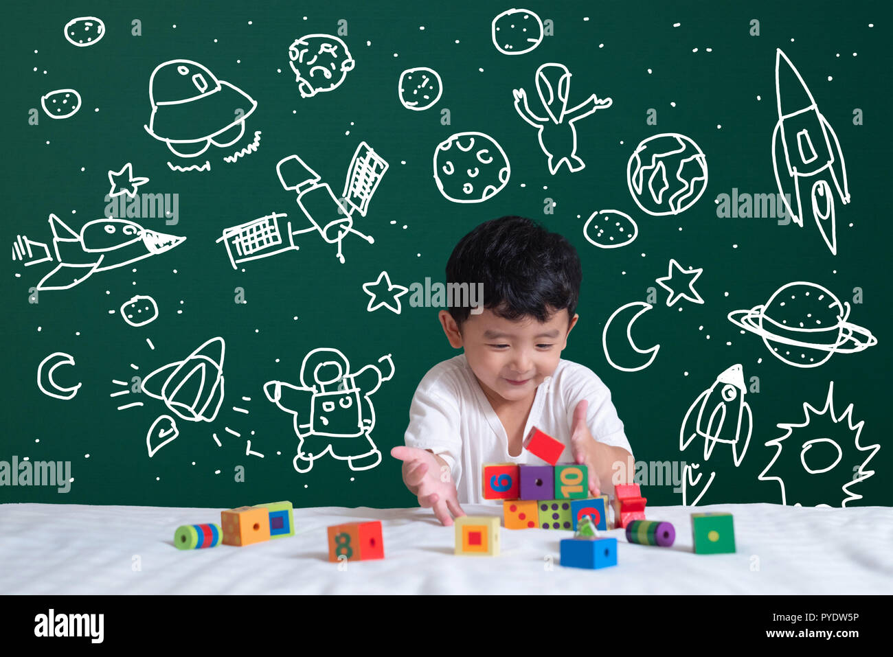 Asian kid learning by playing with his imagination about science and ...