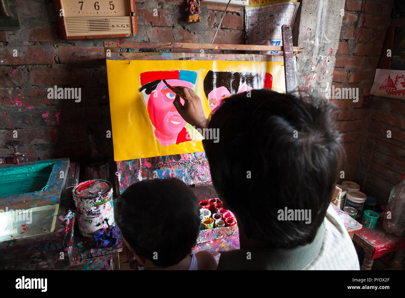 Proshanto Kumar Das, son of Raj Kumar Das, best known as RK Das, one of the first generation rickshaw artists in Bangladesh, is busy in painting a ric Stock Photo