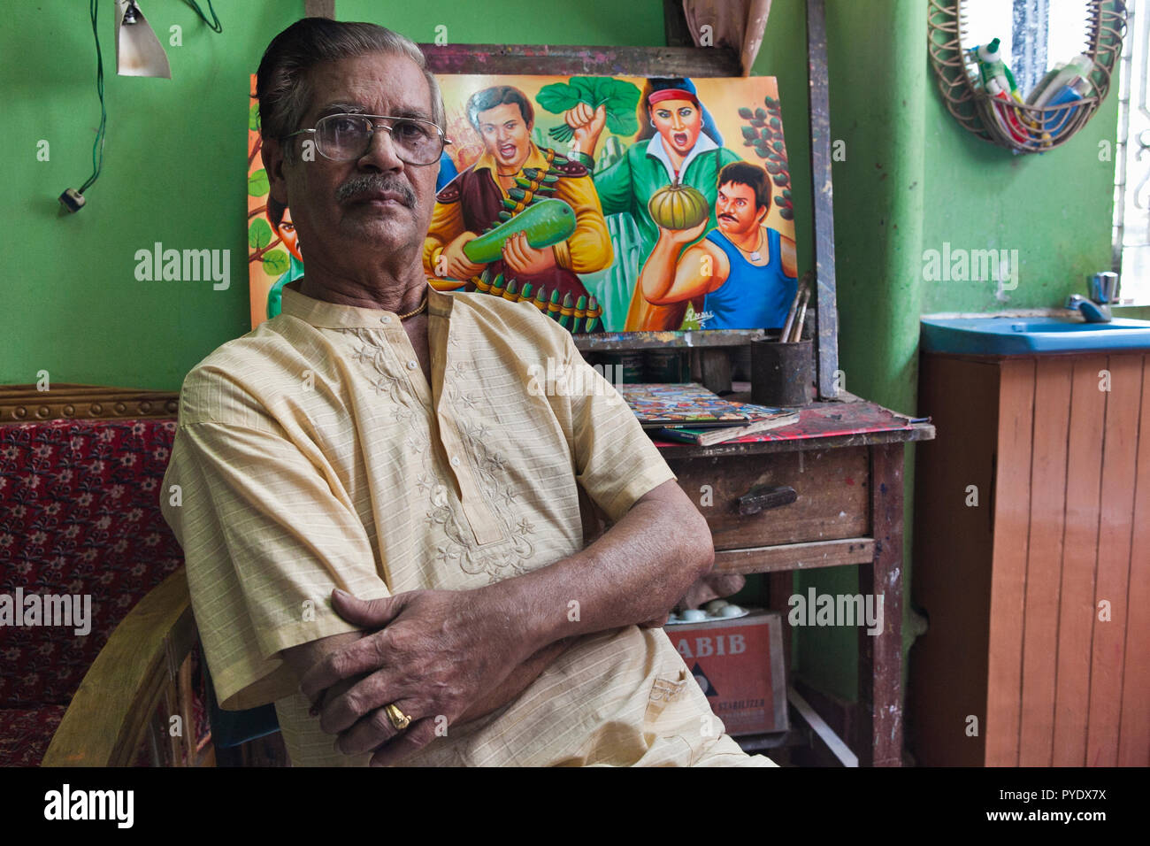 Raju Kumar Das, best known as RK Das, one of the first generation rickshaw artists in Bangladesh, is at his studio in capital Dhaka, on May 8, 2012. T Stock Photo