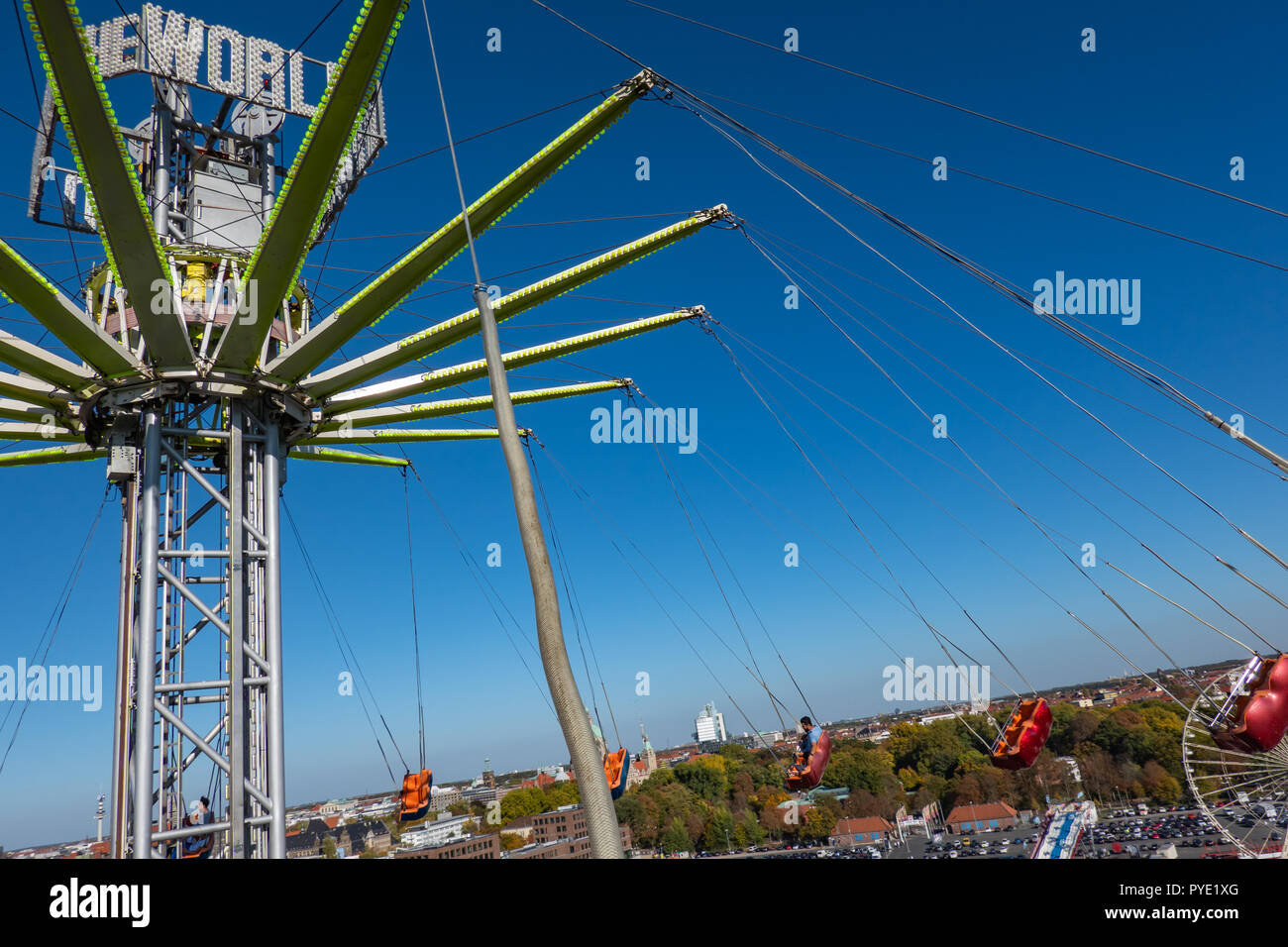 Honnover, Lower Saxony, Germany, October 13., 2018: Recording from the moving and flying gondola of a large chain carousel with parts of the carousel  Stock Photo
