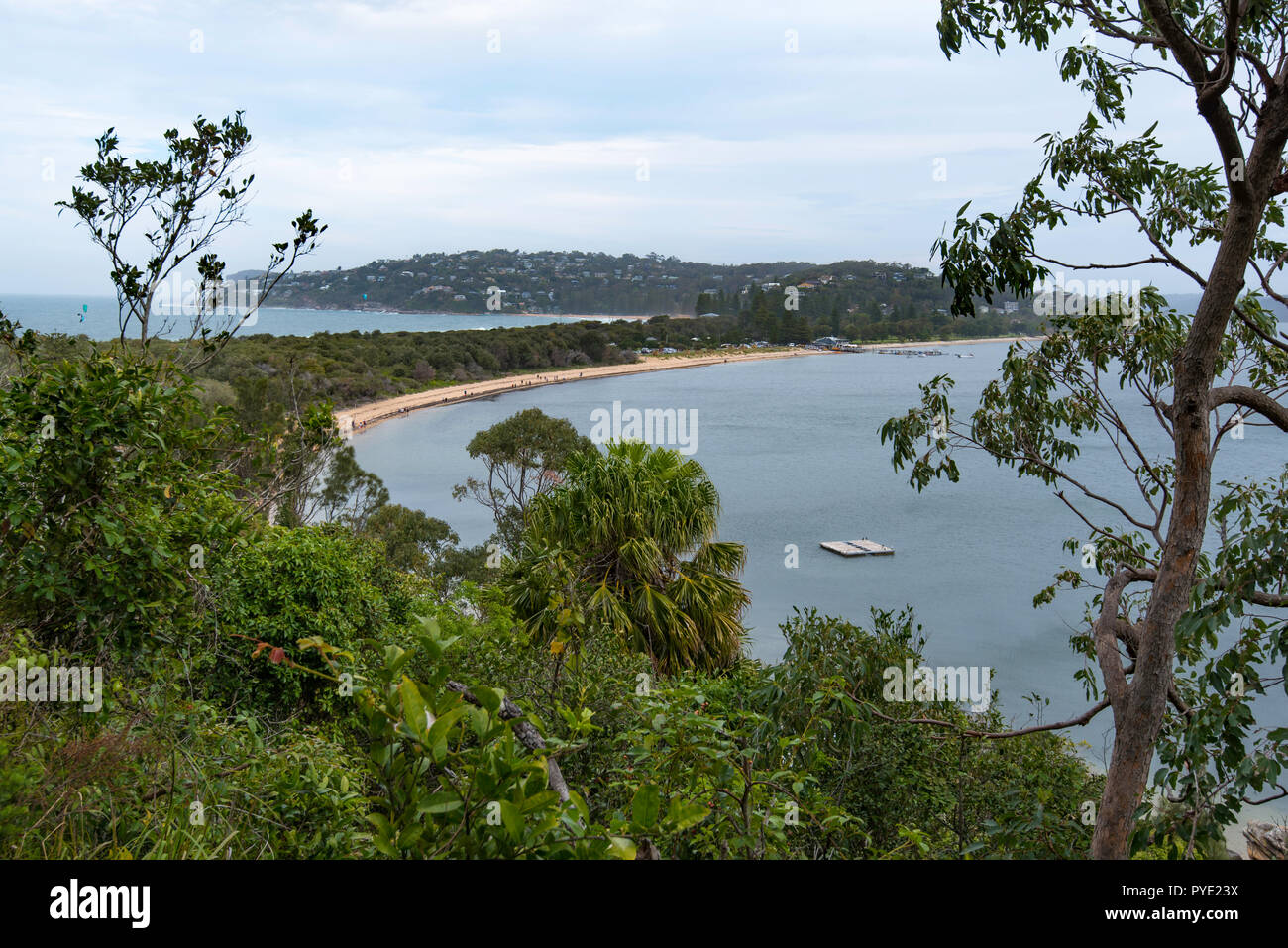 Looking south to Sydney's Palm Beach (left) and Pitt Water (right) with a narrow land spit joining Barrenjoey Headland and lighthouse. Stock Photo