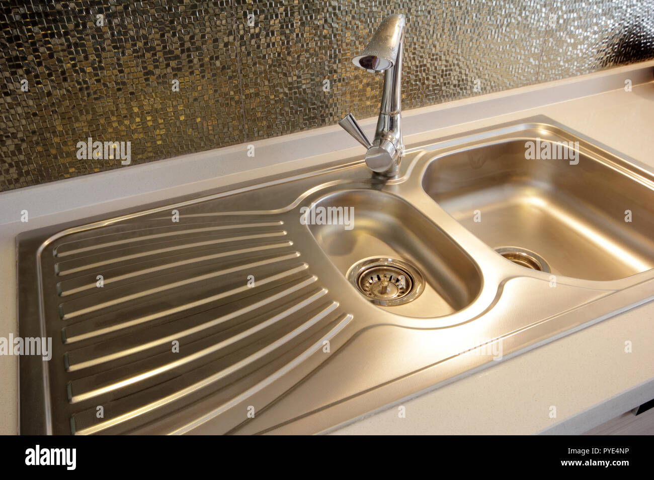 Clean chrome tap and washbasin Stock Photo Alamy