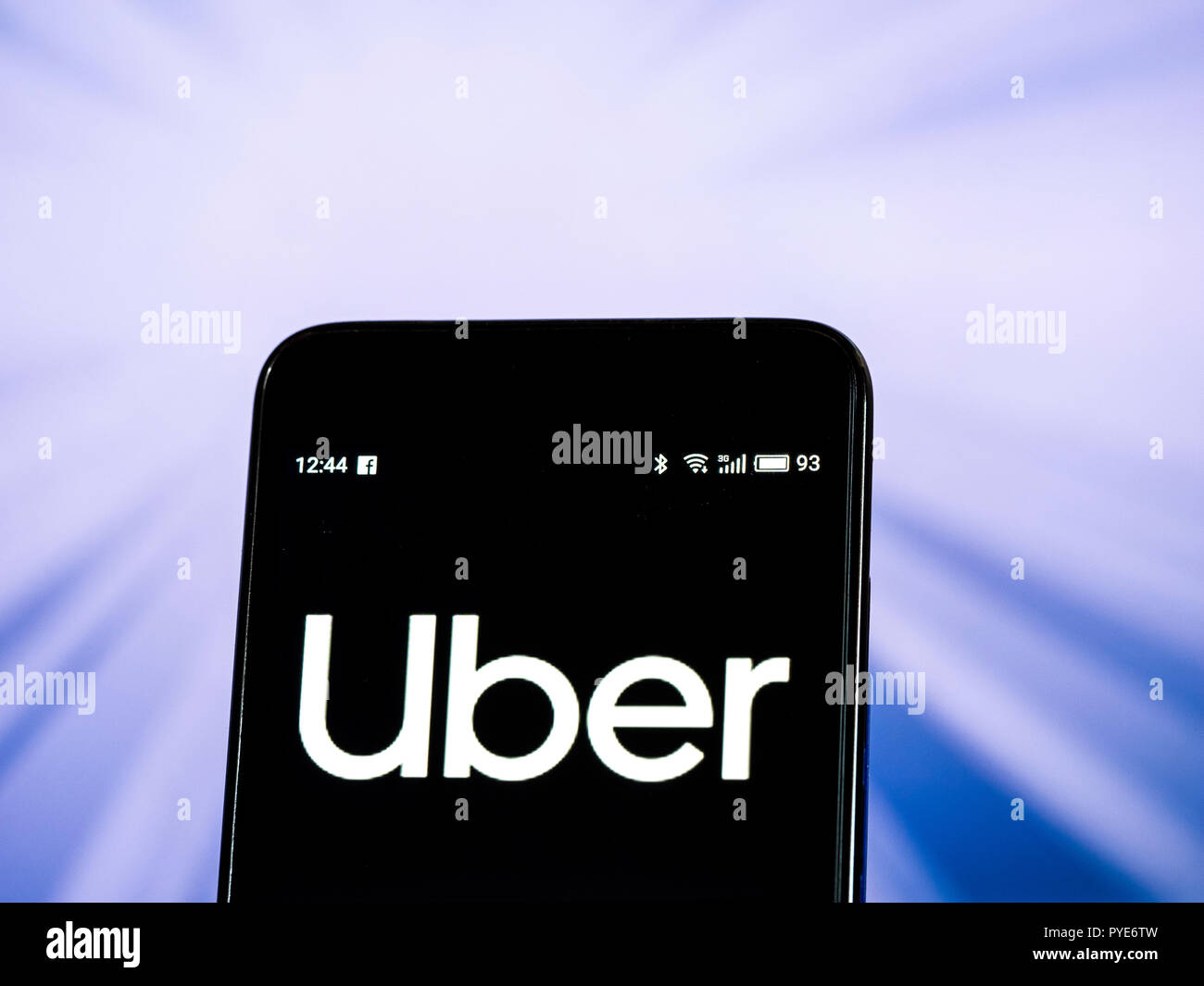 Uber Ridesharing company logo seen displayed on smart phone. Uber  Technologies Inc. is a peer-to-peer ridesharing, taxi cab, food delivery,  bicycle-sharing, and transportation network company Stock Photo - Alamy