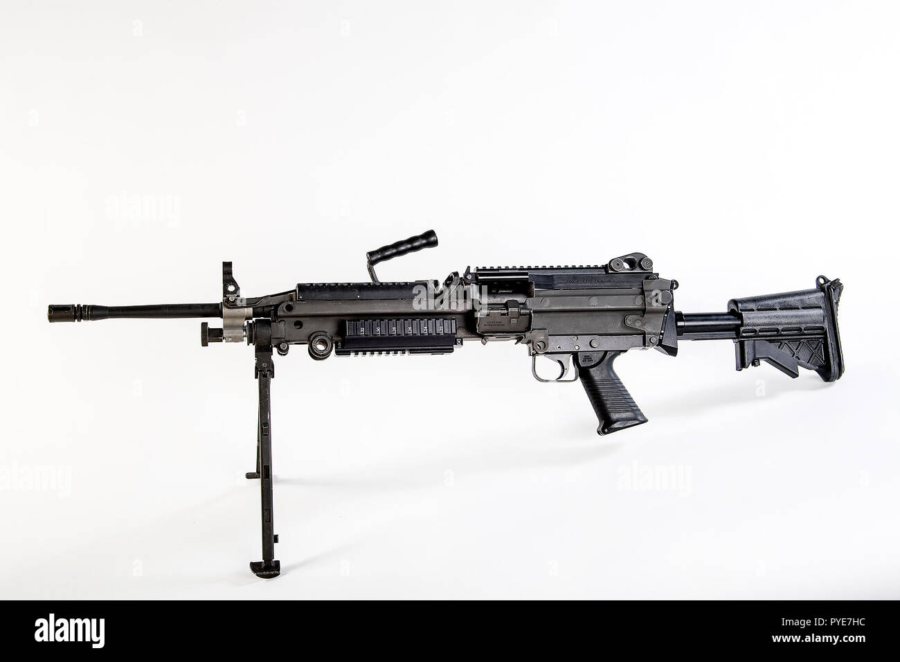 The M249 light machine gun, formerly designated the M249 Squad Automatic Weapon (SAW) and formally written as Light Machine Gun, 5.56 mm, M249, is the American adaptation of the Belgian FN Minimi, a light machine gun manufactured by the Belgian company FN Herstal (FN). The weapon was introduced in 1984 after being judged the most effective of a number of candidate weapons to address the lack of automatic firepower in small units. The M249 provides infantry squads with the high rate of fire of a machine gun combined with accuracy and portability approaching that of a rifle.    The M249 is gas o Stock Photo