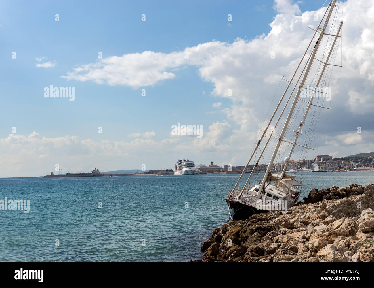 Yacht washed up on shore after storm in Palma de Mallorca Stock Photo