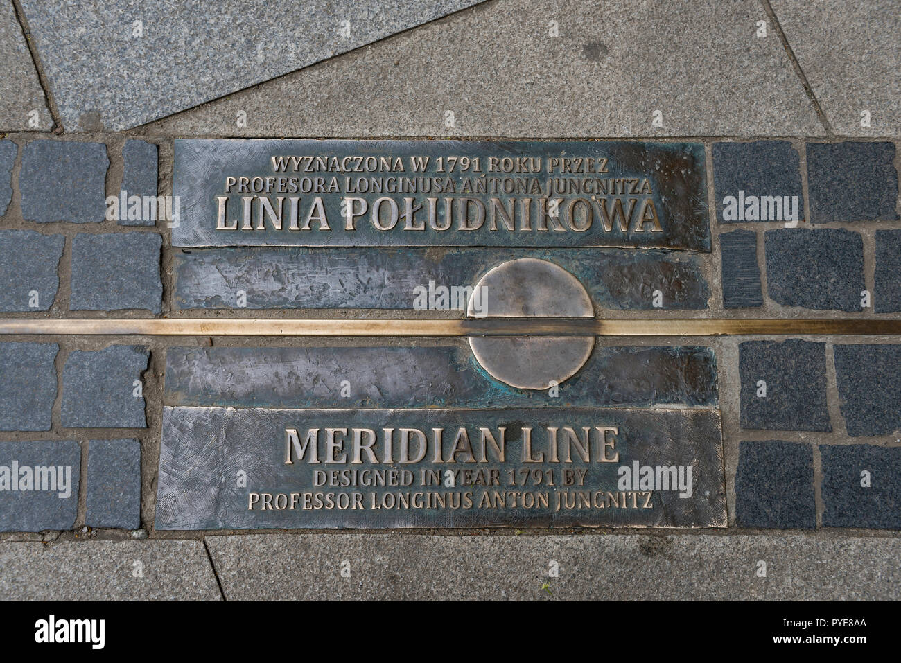 View of a pavement block notifying passersby of the 17th Meridian which passes through the city of Wroclaw in Poland. Stock Photo