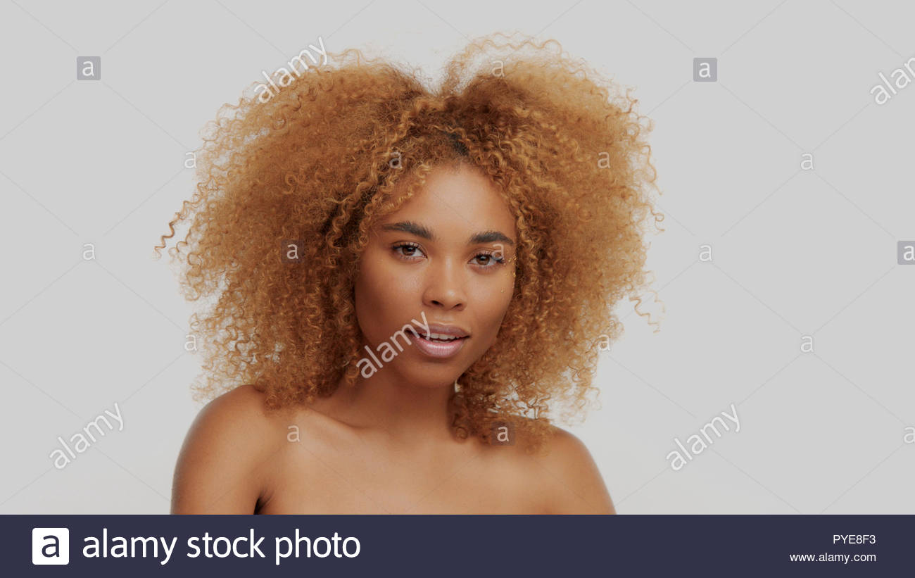 Mixed Race Black Blonde Model With Curly Hair Stock Photo