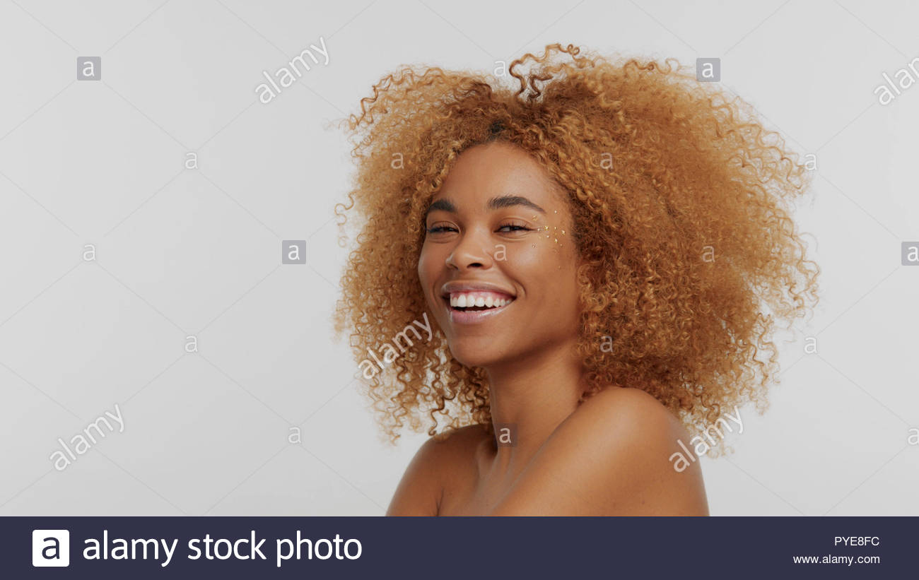 Mixed Race Black Blonde Model With Curly Hair Stock Photo