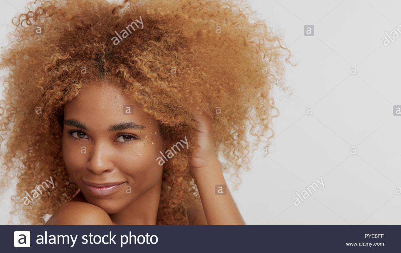 Mixed Race Black Blonde Model With Curly Hair Stock Photo