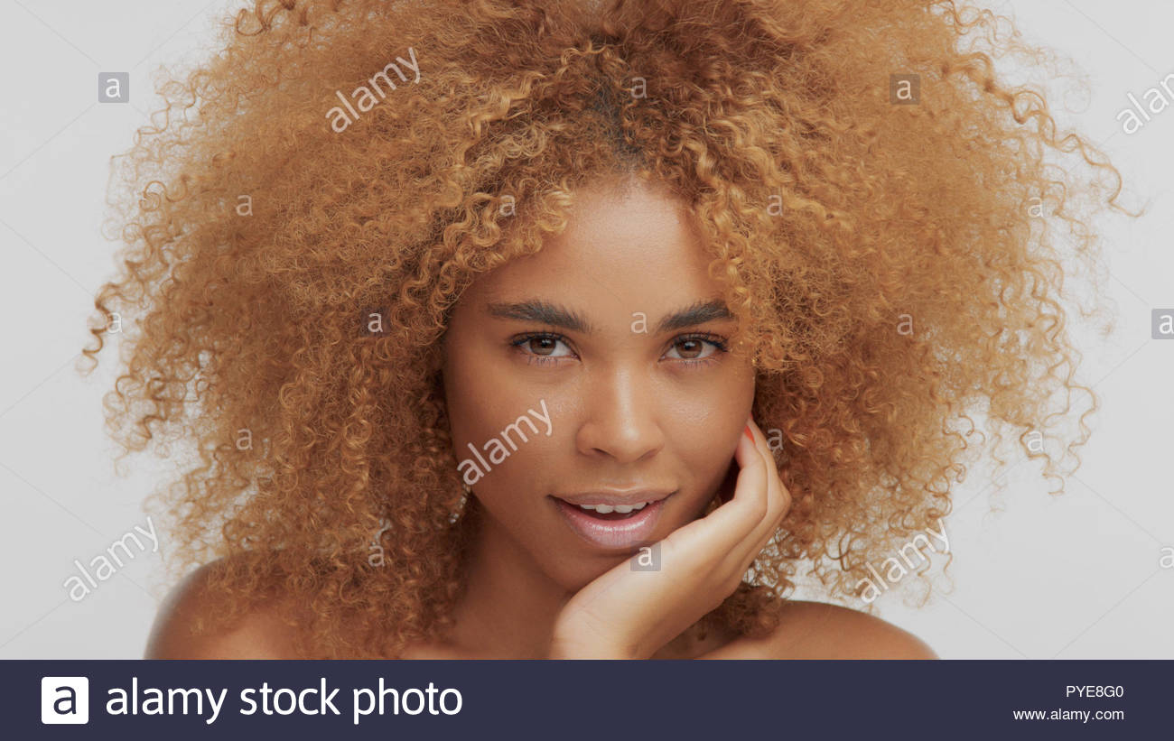 Mixed Race Black Blonde Model With Curly Hair Stock Photo