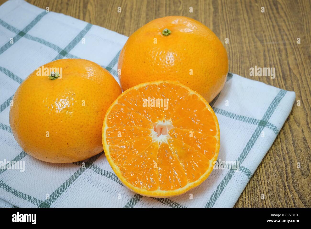 Fresh Ripe Whole and Cross Section Oranges on A Wooden Table, Orange Is ...