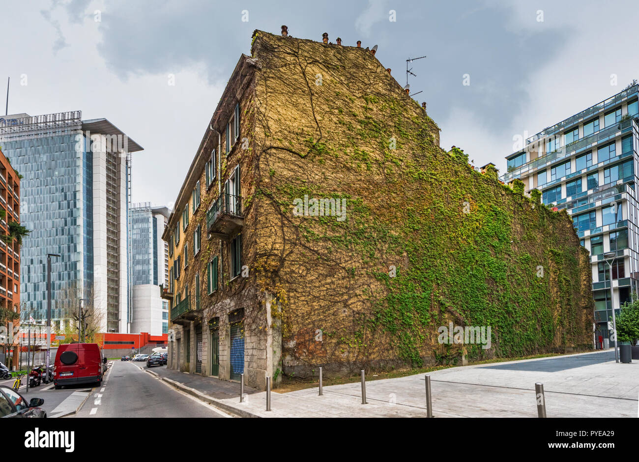 House with creeping plant at the streets of Milan Stock Photo