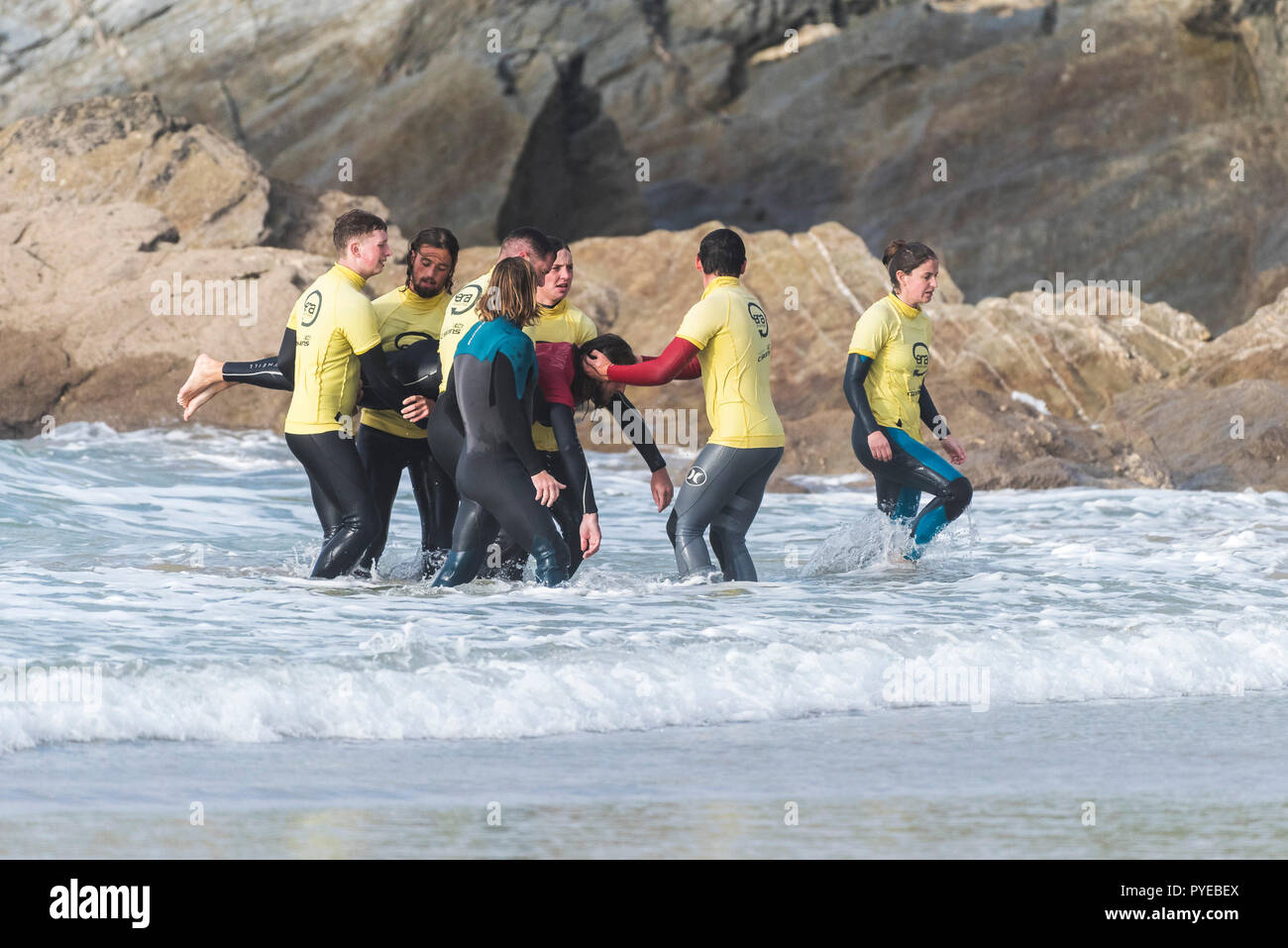 Trainees practising retrieving a casualty from the sea during a Beach Lifeguard Training course at Fistral Beach in Newquay in Cornwall. Stock Photo